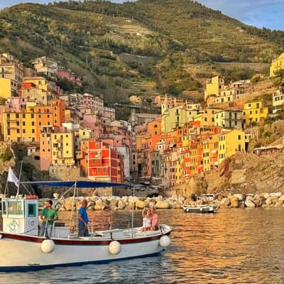 Cinque Terre sunset boat tour with a traditional ligurian gozzo